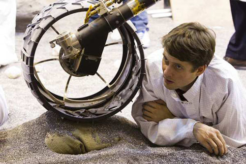 Joseph Carsten watches a test of the Curiosity rover model at Jet Propulsion Laboratory